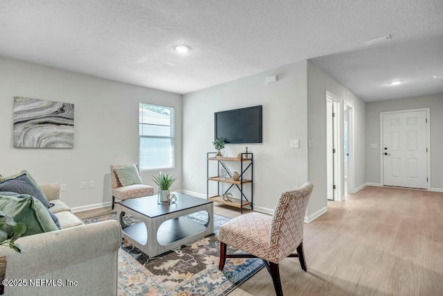 5454 Amazon Ave, Jacksonville, FL 32254 - living area with recessed lighting, a textured ceiling, light wood finished floors, and baseboards