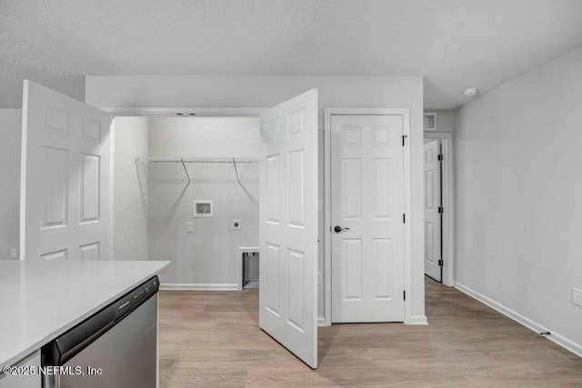 5454 Amazon Ave, Jacksonville, FL 32254 - laundry area featuring laundry area, hookup for an electric dryer, light wood-style floors, baseboards, and washer hookup