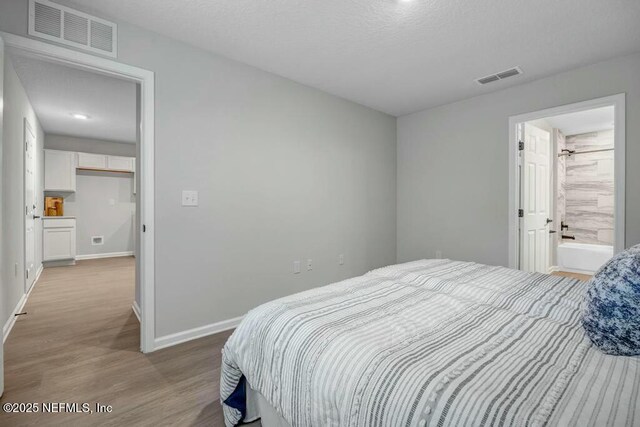 5454 Amazon Ave, Jacksonville, FL 32254 - bedroom featuring wood finished floors, visible vents, and baseboards