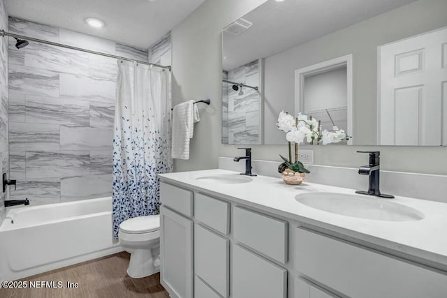 5454 Amazon Ave, Jacksonville, FL 32254 - bathroom featuring wood finished floors, visible vents, toilet, and a sink
