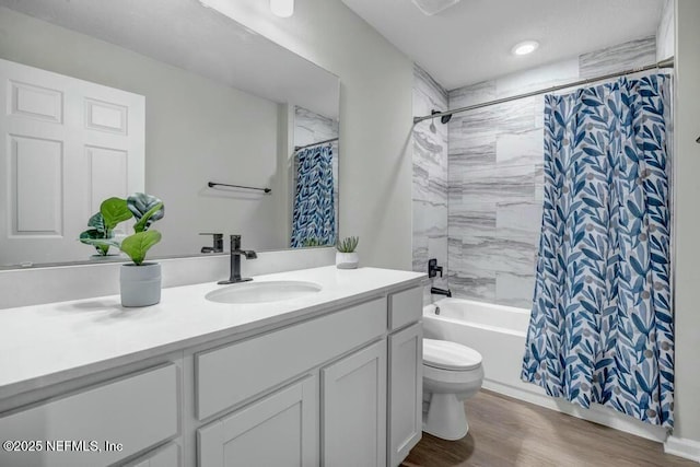 5454 Amazon Ave, Jacksonville, FL 32254 - full bathroom featuring shower / tub combo, toilet, vanity, and wood finished floors