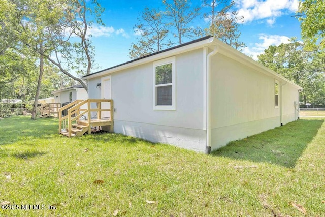 5454 Amazon Ave, Jacksonville, FL 32254 - view of side of property featuring a lawn