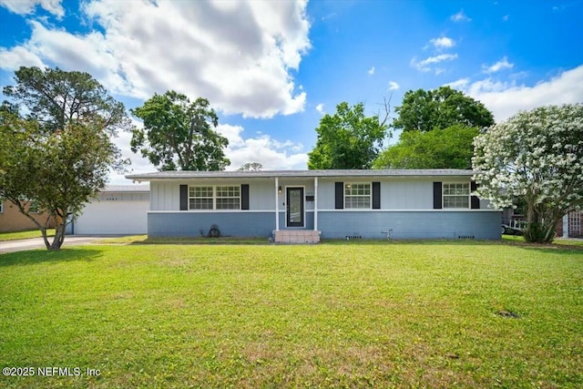 single story home featuring a garage, a front lawn, board and batten siding, and concrete driveway