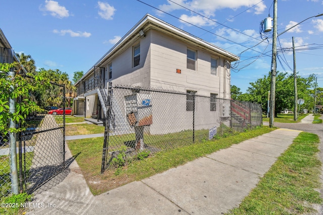 1330 Barnett St, Jacksonville, FL 32209 - view of side of property with fence and concrete block siding