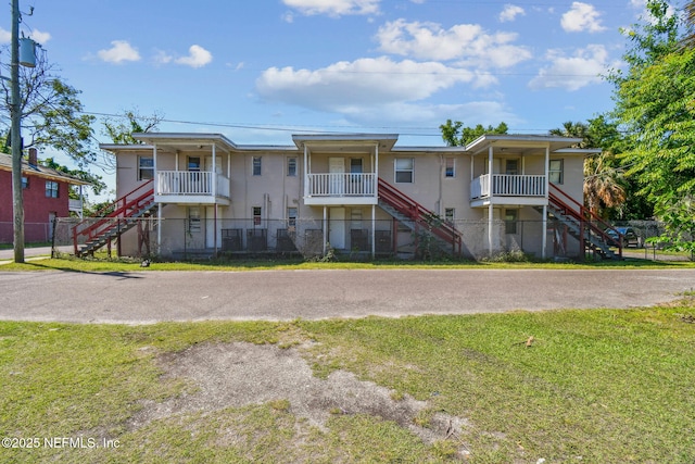 1330 Barnett St, Jacksonville, FL 32209 - view of front facade with fence, stairway, and a front lawn