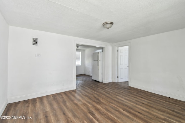 1330 Barnett St, Jacksonville, FL 32209 - empty room with baseboards, visible vents, wood finished floors, and a textured ceiling