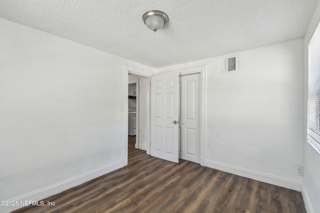 1330 Barnett St, Jacksonville, FL 32209 - unfurnished bedroom with dark wood-type flooring, visible vents, a closet, and baseboards