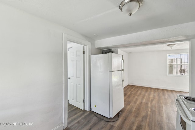 1330 Barnett St, Jacksonville, FL 32209 - kitchen with dark wood finished floors, baseboards, and white appliances