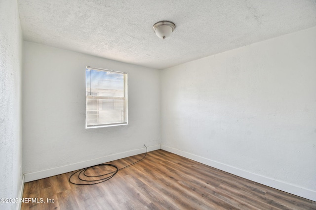 1330 Barnett St, Jacksonville, FL 32209 - unfurnished room with a textured ceiling, wood finished floors, and baseboards