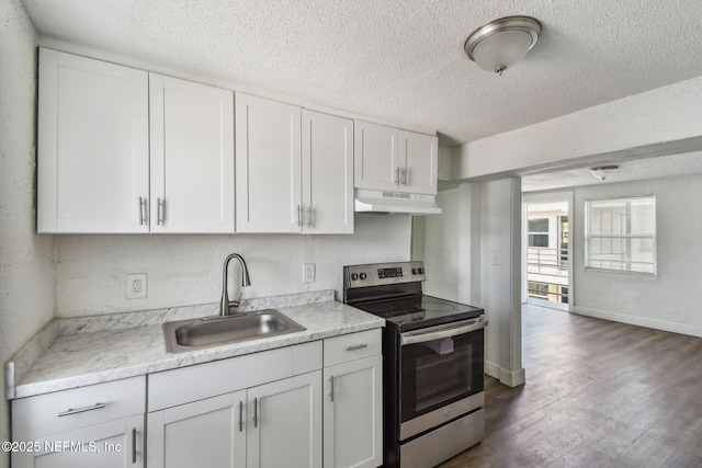 1330 Barnett St, Jacksonville, FL 32209 - kitchen with stainless steel electric stove, a textured ceiling, under cabinet range hood, and a sink