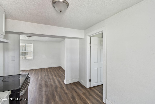 1330 Barnett St, Jacksonville, FL 32209 - interior space with a textured ceiling, dark wood-style floors, and baseboards