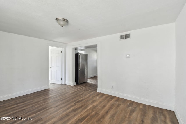 1330 Barnett St, Jacksonville, FL 32209 - spare room featuring dark wood-style flooring, visible vents, and baseboards
