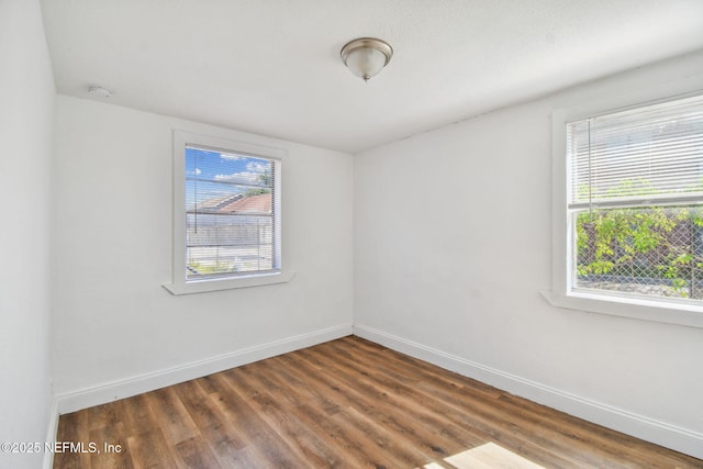 1330 Barnett St, Jacksonville, FL 32209 - spare room featuring wood finished floors and baseboards