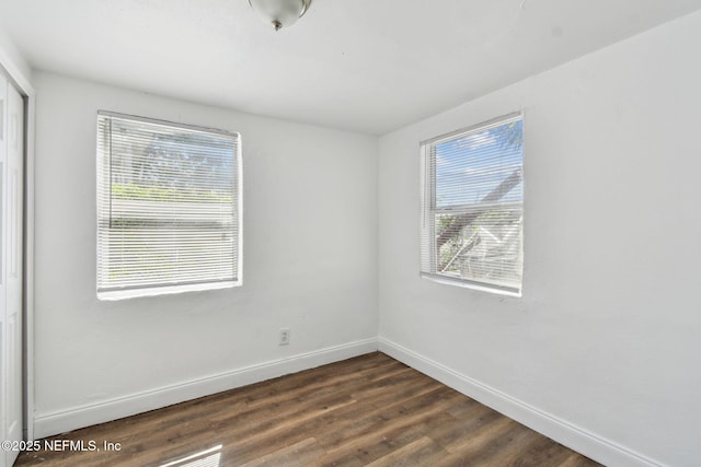 1330 Barnett St, Jacksonville, FL 32209 - spare room with dark wood-style flooring, baseboards, and plenty of natural light