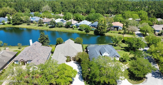 drone / aerial view featuring a water view and a residential view