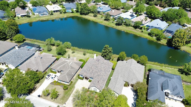 bird's eye view with a water view and a residential view