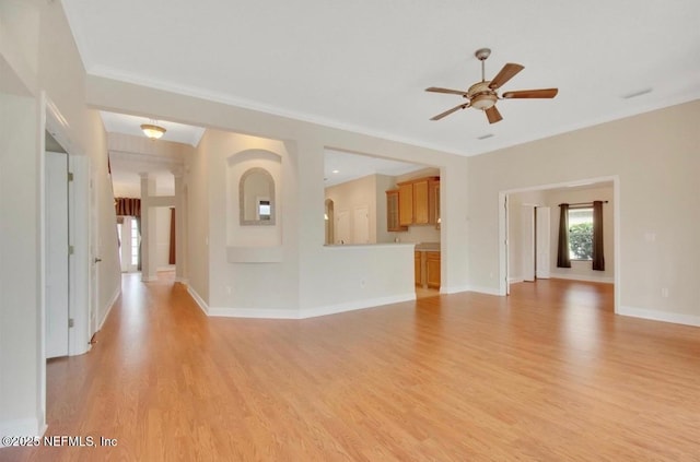unfurnished living room featuring a ceiling fan, baseboards, ornamental molding, and light wood finished floors