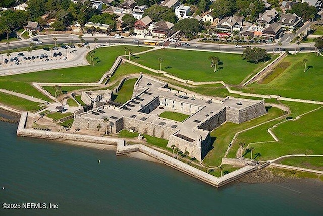 drone / aerial view featuring a water view and a residential view