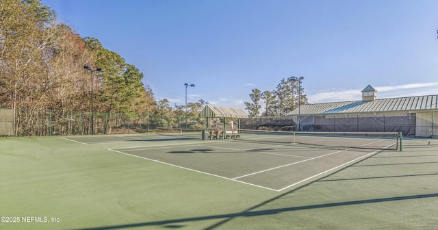 view of sport court with community basketball court and fence