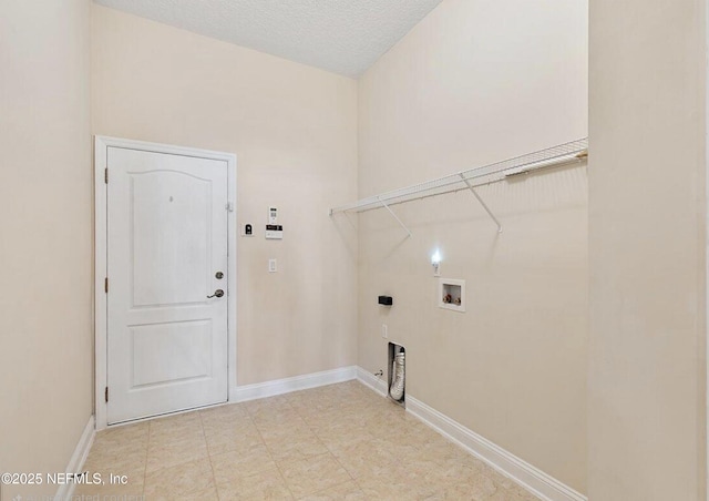 clothes washing area featuring baseboards, laundry area, electric dryer hookup, and hookup for a washing machine