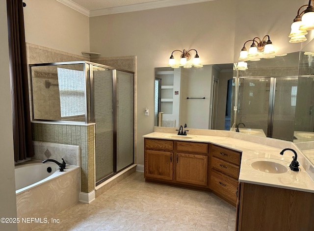 bathroom featuring crown molding, double vanity, a shower stall, and a sink