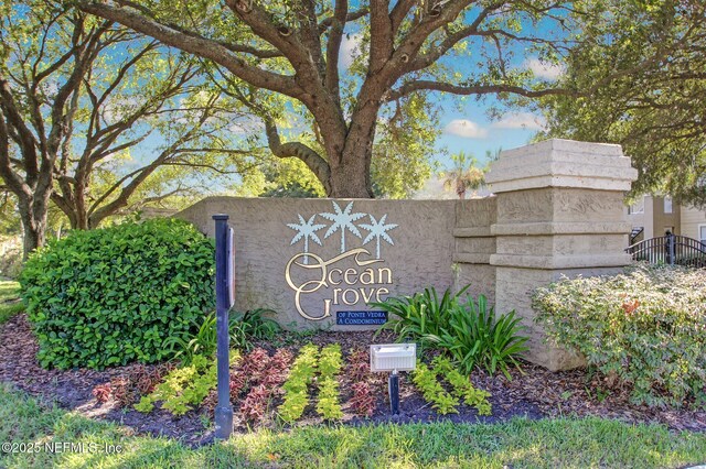 community sign featuring fence