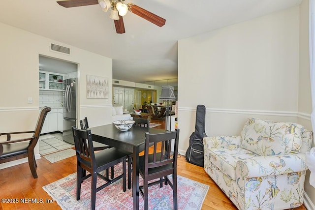 4334 Plaza Gate Ln S Unit 202, Jacksonville, FL 32217 - dining room featuring ceiling fan, wood finished floors, and visible vents