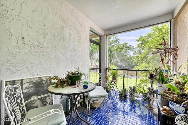 4334 Plaza Gate Ln S Unit 202, Jacksonville, FL 32217 - sunroom / solarium with a textured wall and tile patterned flooring