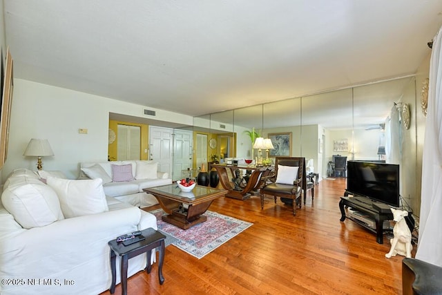 4334 Plaza Gate Ln S Unit 202, Jacksonville, FL 32217 - living area with visible vents and wood finished floors