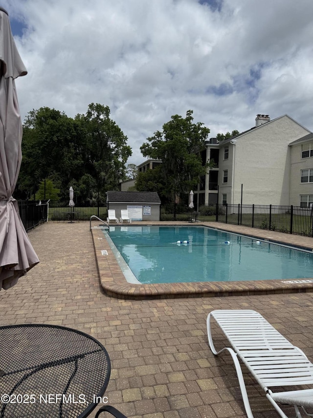 4334 Plaza Gate Ln S Unit 202, Jacksonville, FL 32217 - pool featuring fence and a patio area