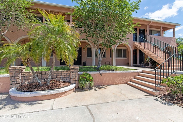 5375 Ortega Farms Blvd Unit 711, Jacksonville, FL 32210 - view of front of property with stucco siding and stairway