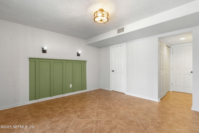 5375 Ortega Farms Blvd Unit 711, Jacksonville, FL 32210 - unfurnished bedroom featuring a textured ceiling, baseboards, and visible vents