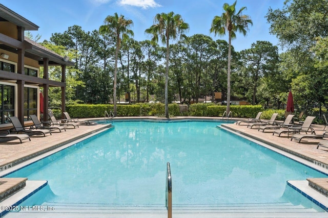 100 Fairway Park Blvd Unit 1101, Ponte Vedra Beach, FL 32082 - community pool with a patio area and view of wooded area