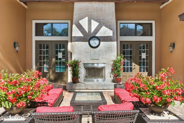 100 Fairway Park Blvd Unit 1101, Ponte Vedra Beach, FL 32082 - living room with french doors and an outdoor stone fireplace