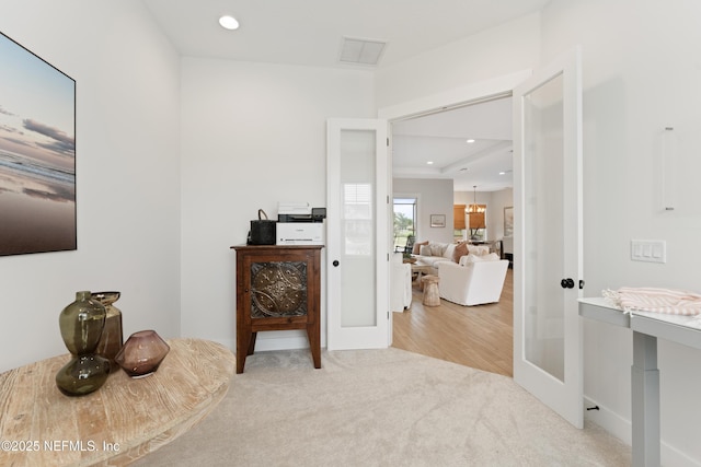 hallway featuring visible vents, recessed lighting, carpet floors, and french doors