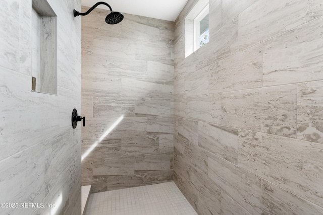 full bathroom featuring tiled shower