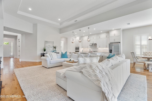 314 Freshwater Dr, Saint Johns, FL 32259 - living area featuring a raised ceiling, baseboards, recessed lighting, and light wood-style flooring