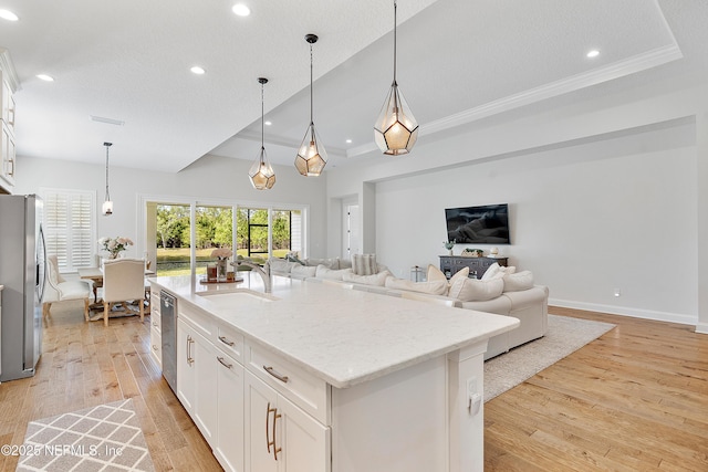 314 Freshwater Dr, Saint Johns, FL 32259 - kitchen featuring white cabinets, open floor plan, stainless steel appliances, and a sink