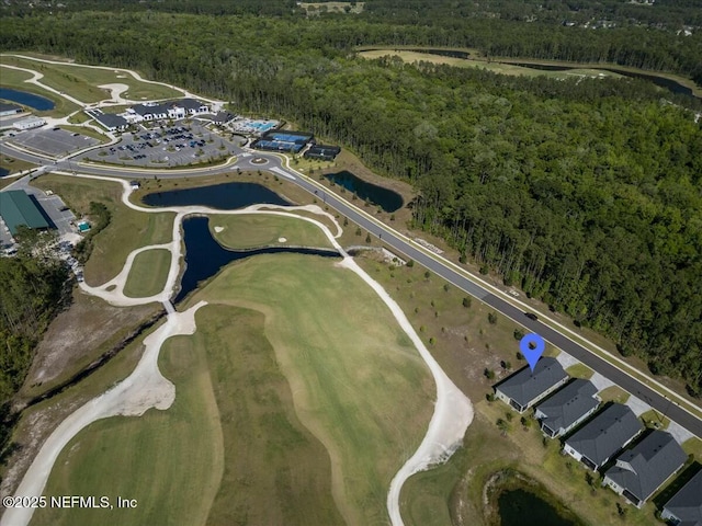 bird's eye view featuring view of golf course, a forest view, and a water view