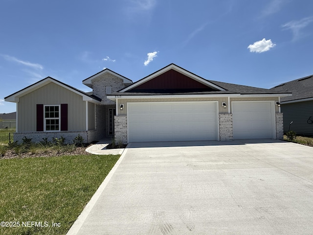 8340 Helmsley Blvd, Jacksonville, FL 32219 - single story home featuring brick siding, an attached garage, driveway, and a front lawn