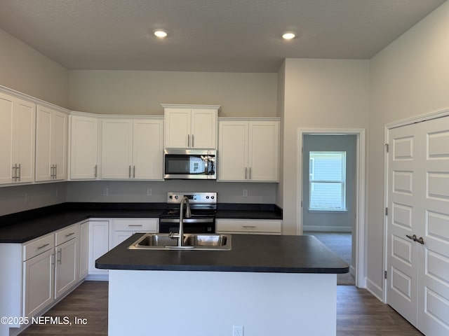 8340 Helmsley Blvd, Jacksonville, FL 32219 - kitchen featuring stainless steel appliances, a sink, dark countertops, dark wood finished floors, and recessed lighting