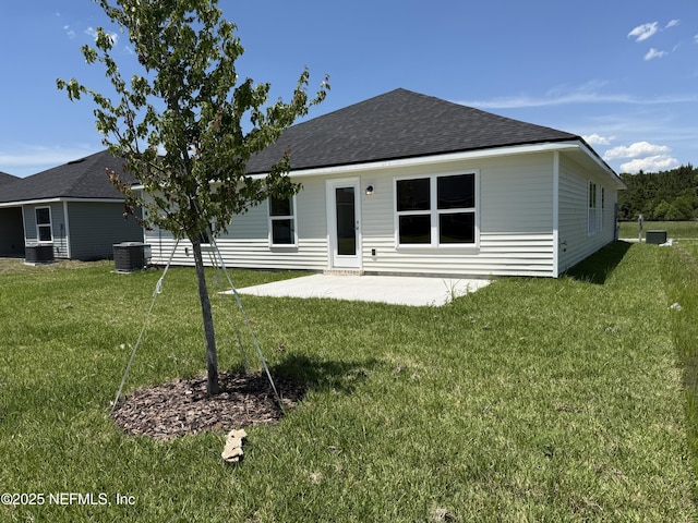 8340 Helmsley Blvd, Jacksonville, FL 32219 - back of property with a patio, a lawn, cooling unit, and roof with shingles