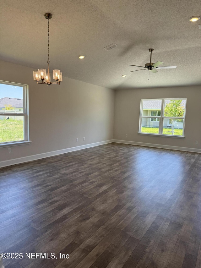 8340 Helmsley Blvd, Jacksonville, FL 32219 - unfurnished room with dark wood finished floors, a chandelier, ceiling fan, baseboards, and a textured ceiling