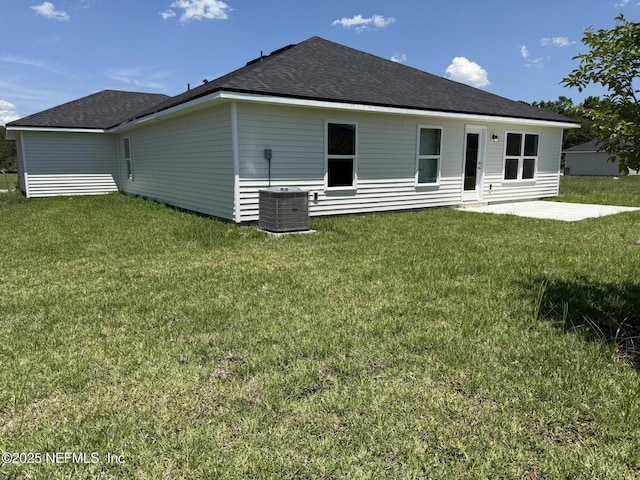 8340 Helmsley Blvd, Jacksonville, FL 32219 - back of property with a patio, a lawn, central AC, and a shingled roof