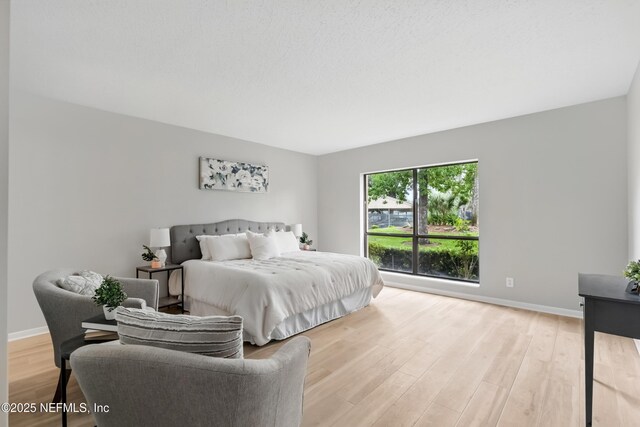 10136 Leisure Ln N Unit 26, Jacksonville, FL 32256 - bedroom with wood finished floors and baseboards