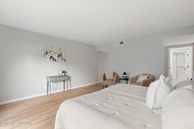 10136 Leisure Ln N Unit 26, Jacksonville, FL 32256 - bedroom with light wood-style floors and baseboards