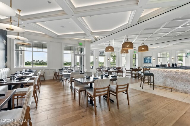 10136 Leisure Ln N Unit 26, Jacksonville, FL 32256 - dining area featuring coffered ceiling, light wood-style flooring, and beam ceiling
