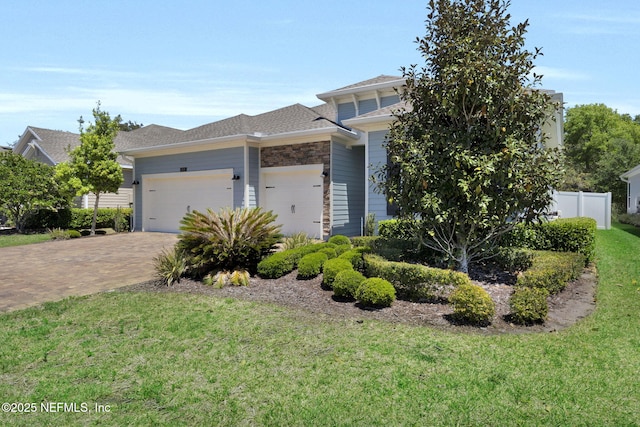 251 Dosel Ln, Saint Augustine, FL 32095 - view of front of property with driveway, fence, a garage, a shingled roof, and a front yard