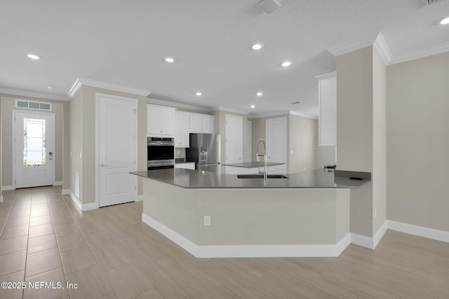 251 Dosel Ln, Saint Augustine, FL 32095 - kitchen featuring visible vents, a sink, baseboards, appliances with stainless steel finishes, and white cabinetry