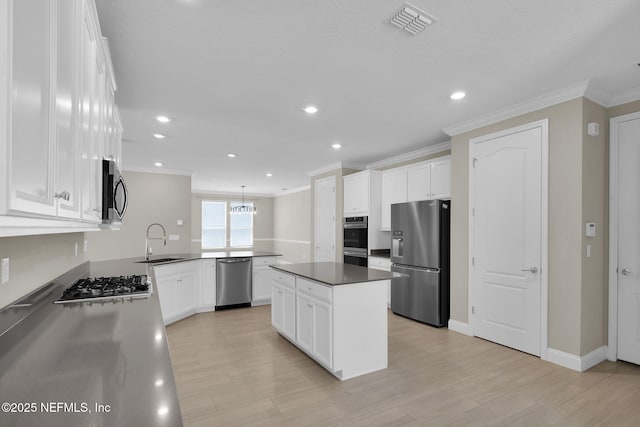 251 Dosel Ln, Saint Augustine, FL 32095 - kitchen featuring stainless steel appliances, visible vents, a sink, and ornamental molding